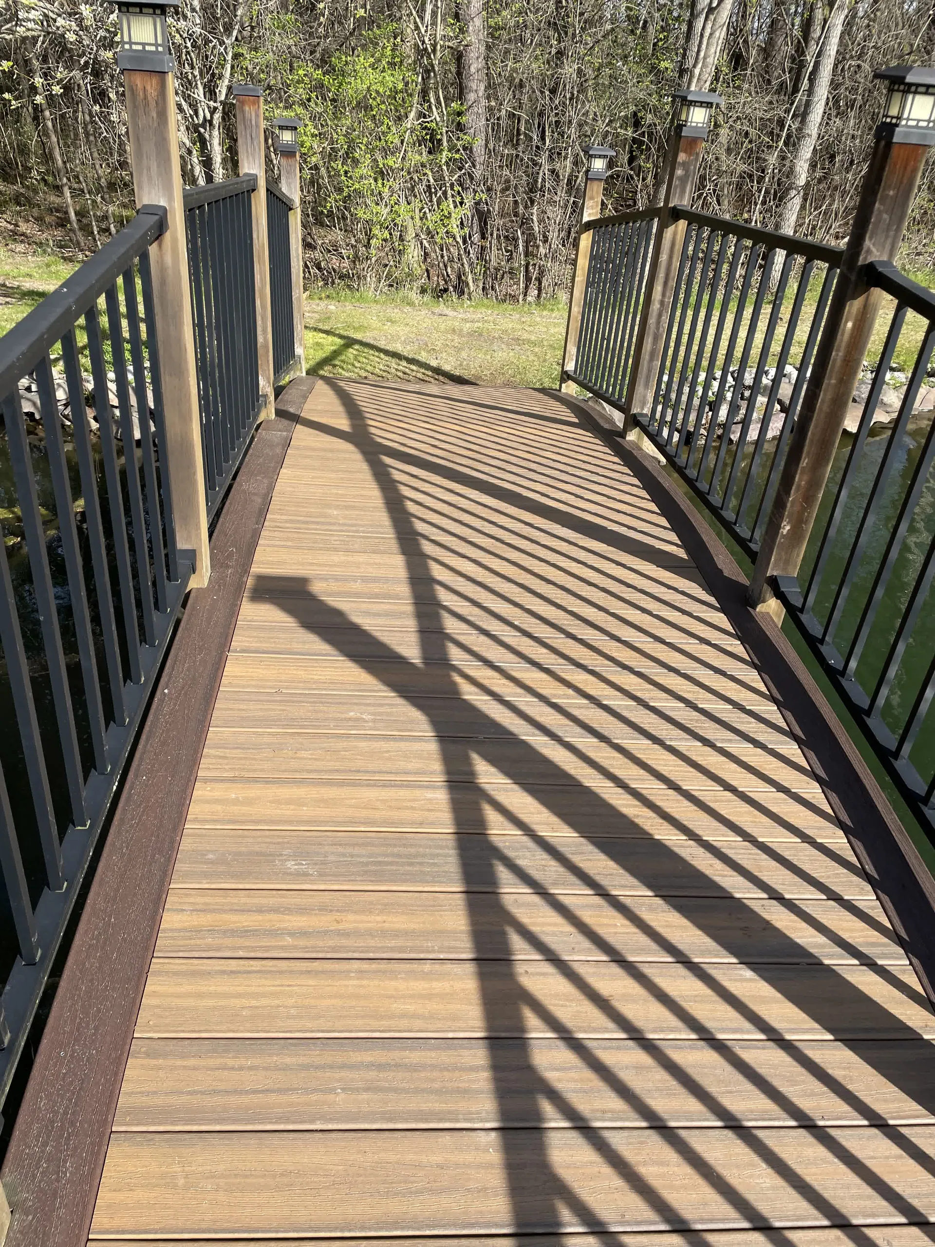 Composite deck and boardwalk with black railing