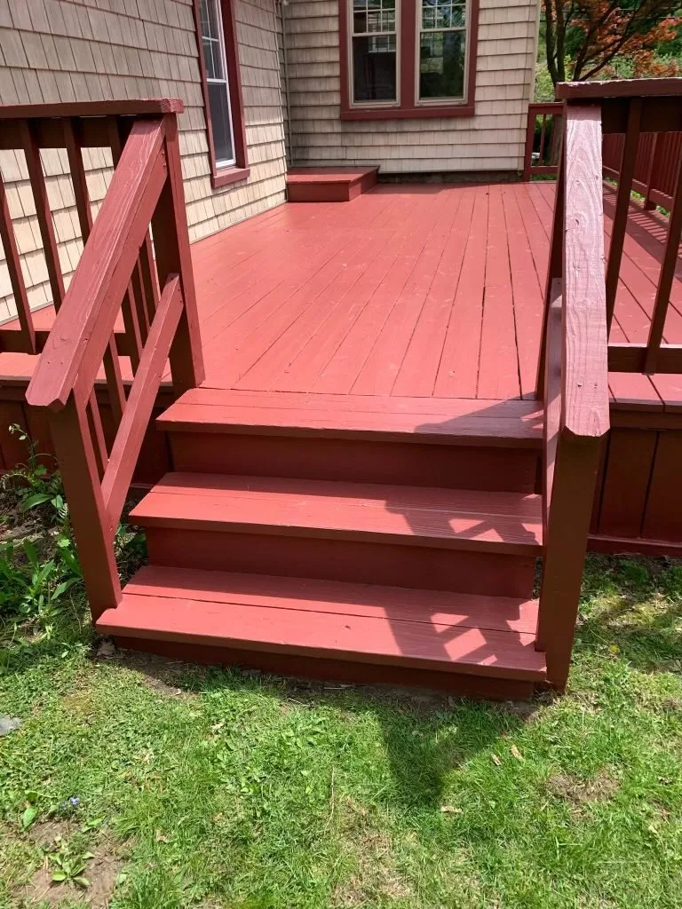 Deck steps and railing after restoration