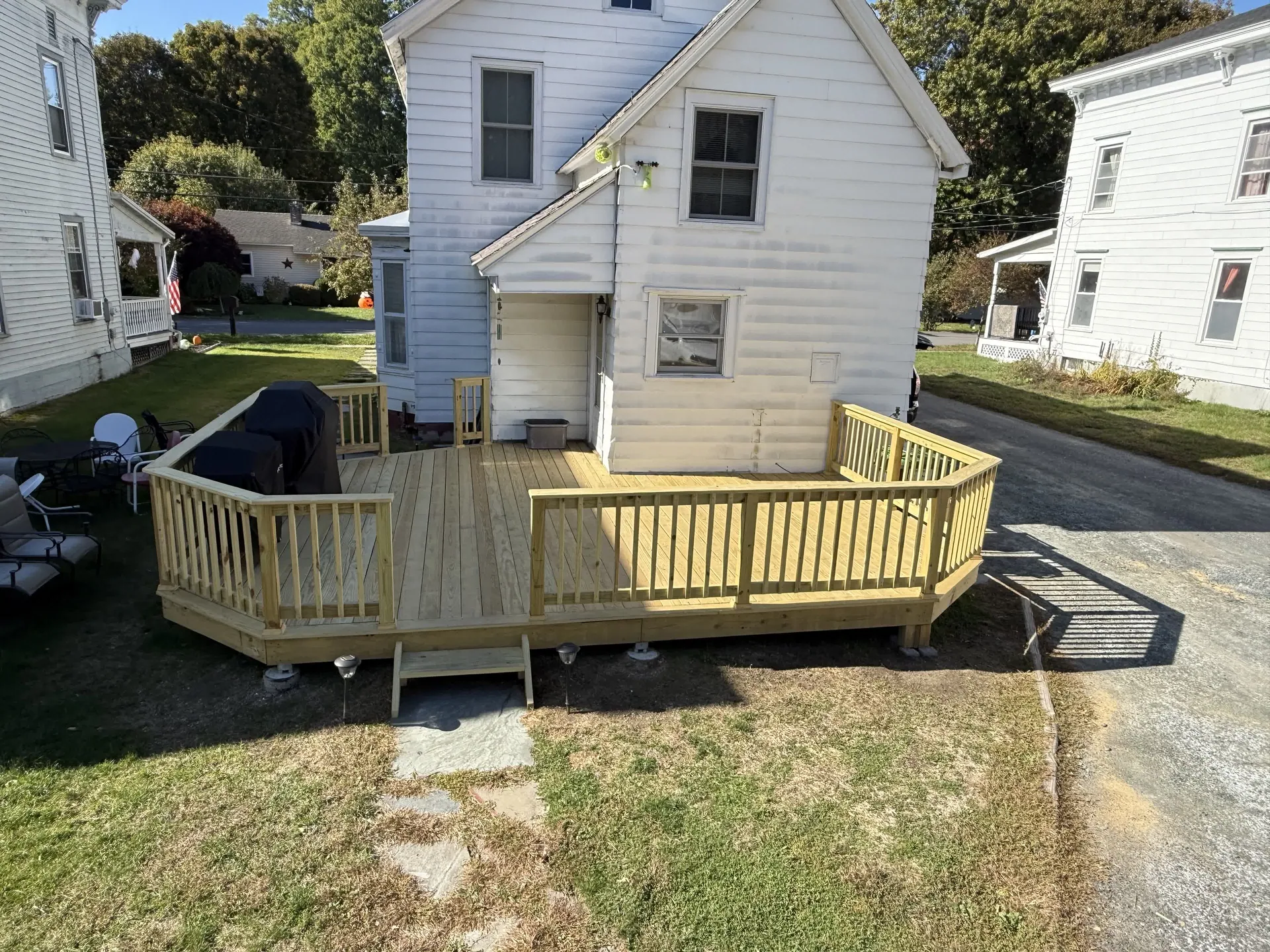 Home with a newly built wraparound porch and deck