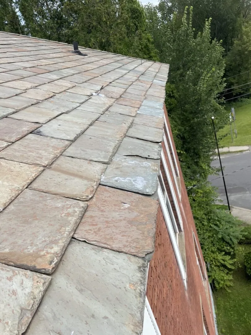 Exterior detail where siding meets brickwork