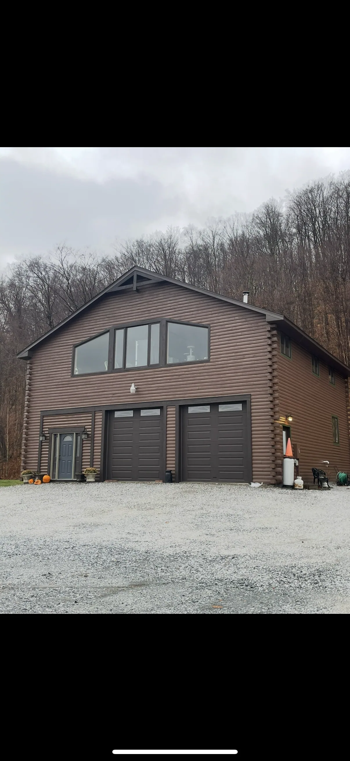 Timber garage and outbuilding on a rural property