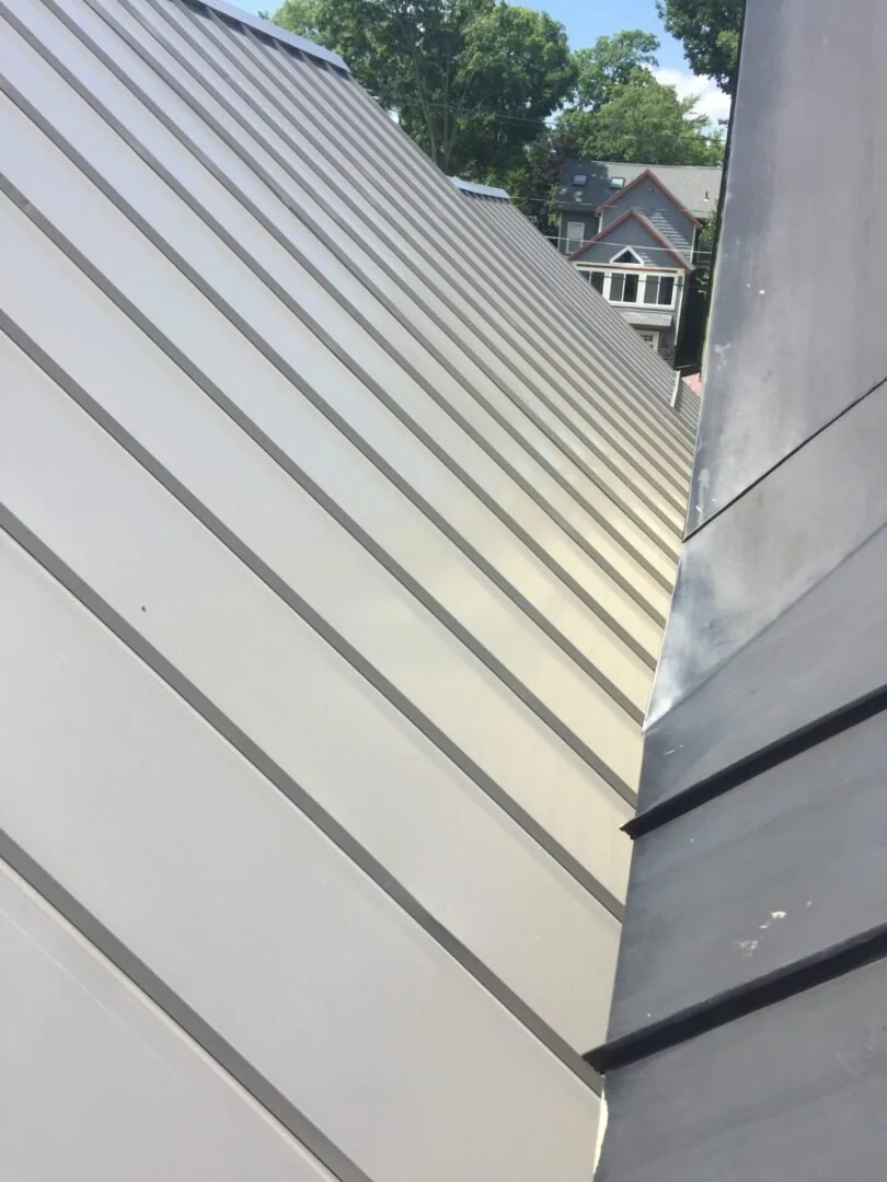Finished metal roofing job with trim and flashing detail