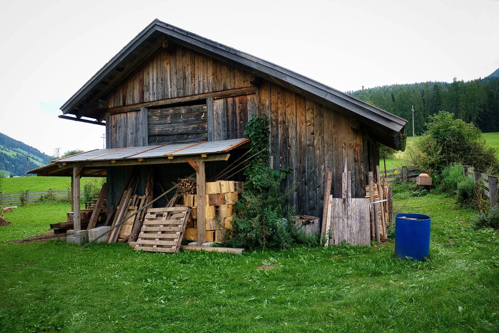 Timber outbuilding with open barn doors built in Upstate New York