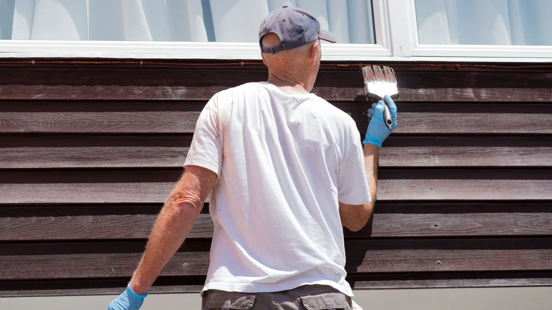Freshly painted clapboard siding showing board shadows