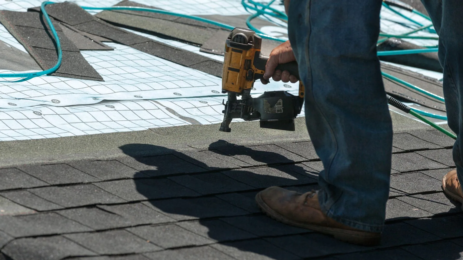 Asphalt shingles being replaced on a residential roof
