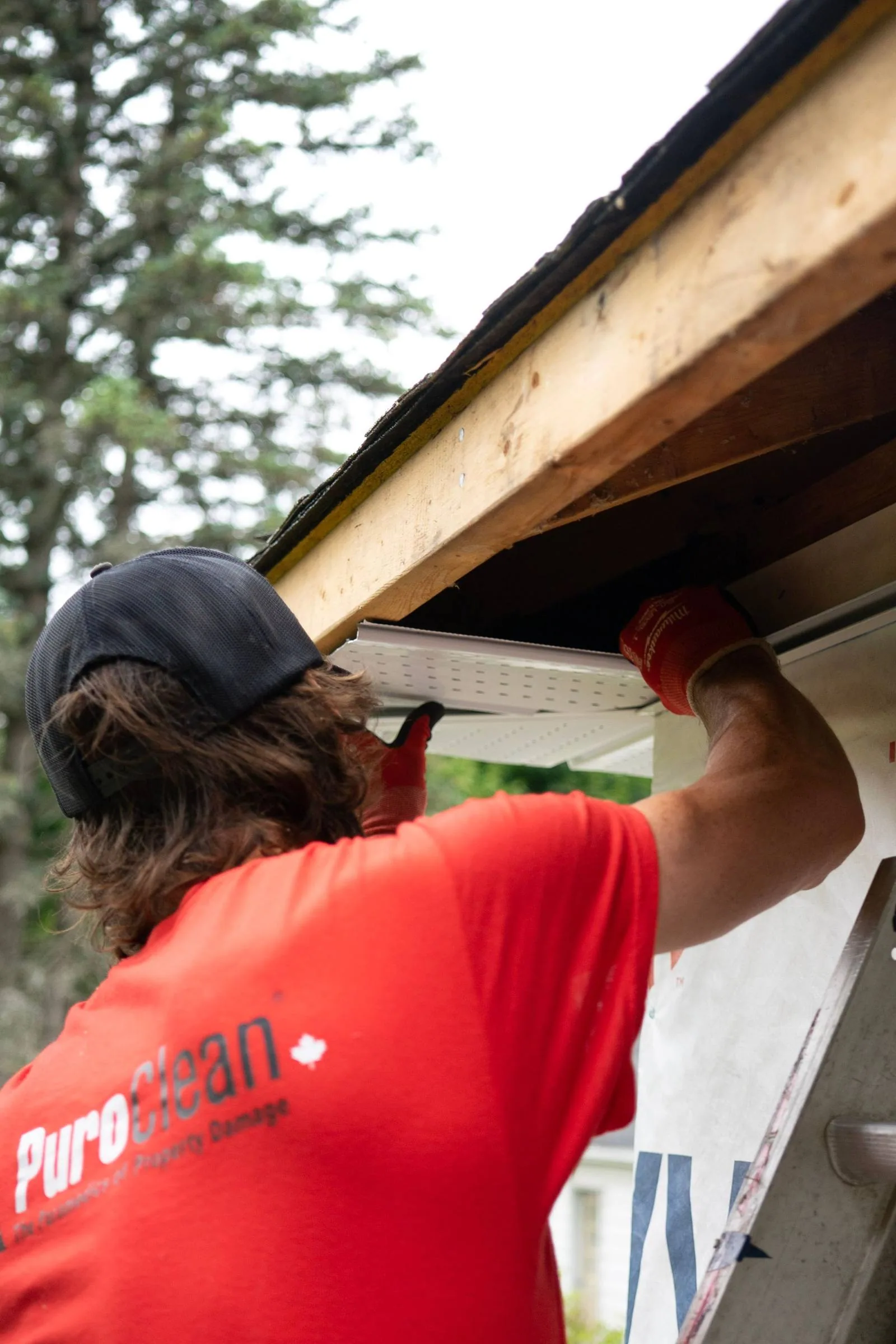 Gutter installation along a residential roof edge