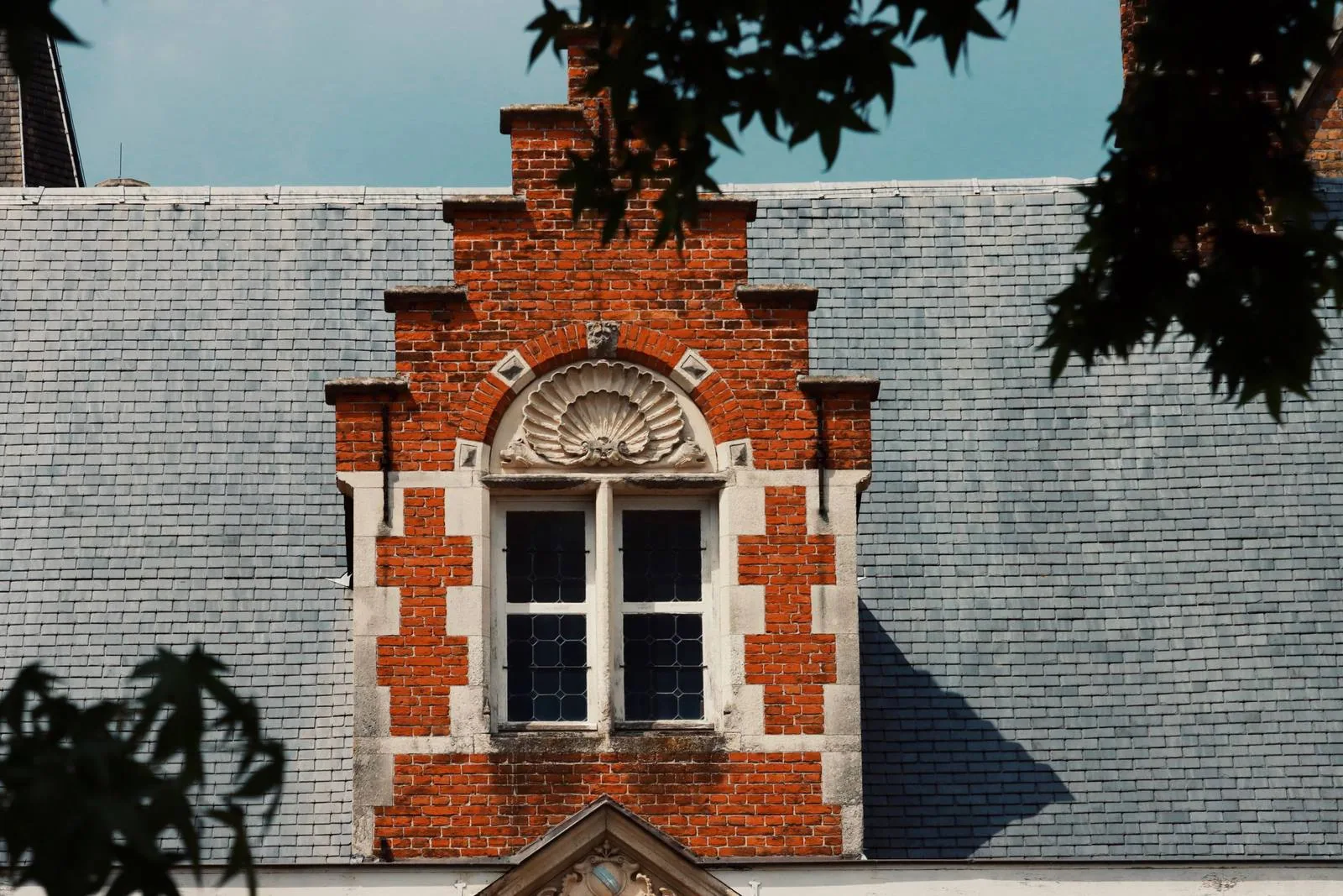 Slate roof repair in progress on a historic Upstate New York home